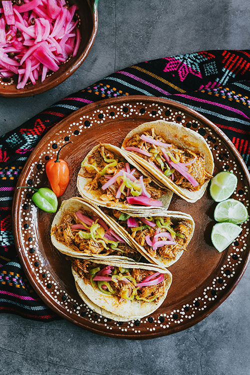 Traditional Latin American street food tacos with shredded meat, pickled onions and lime, seen on a Panama Canal cruise