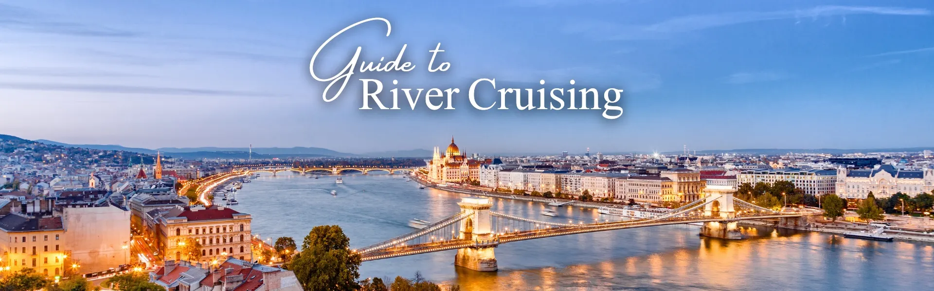 Guide to River Cruising – tranquil river scene with historic town on the banks